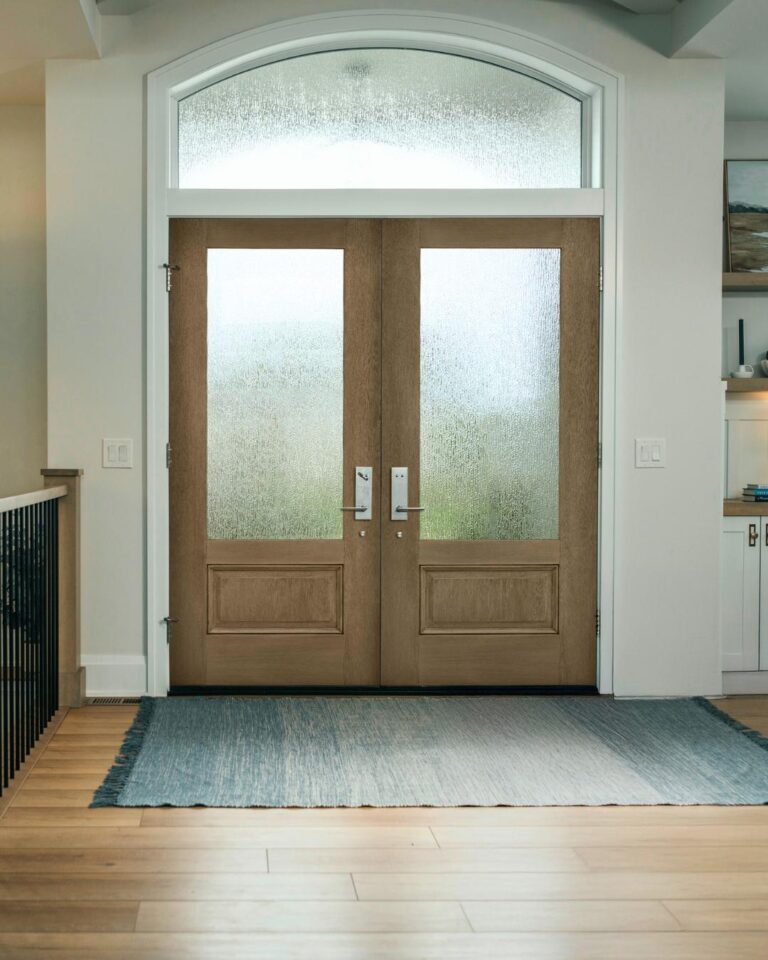 Modern fiberglass front entry door with woodgrain finish