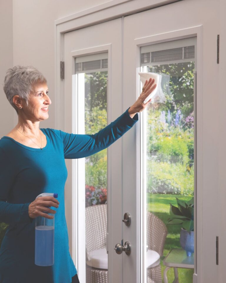 White fiberglass patio door with full glass design allowing maximum natural light and a clean, modern look for home exteriors.